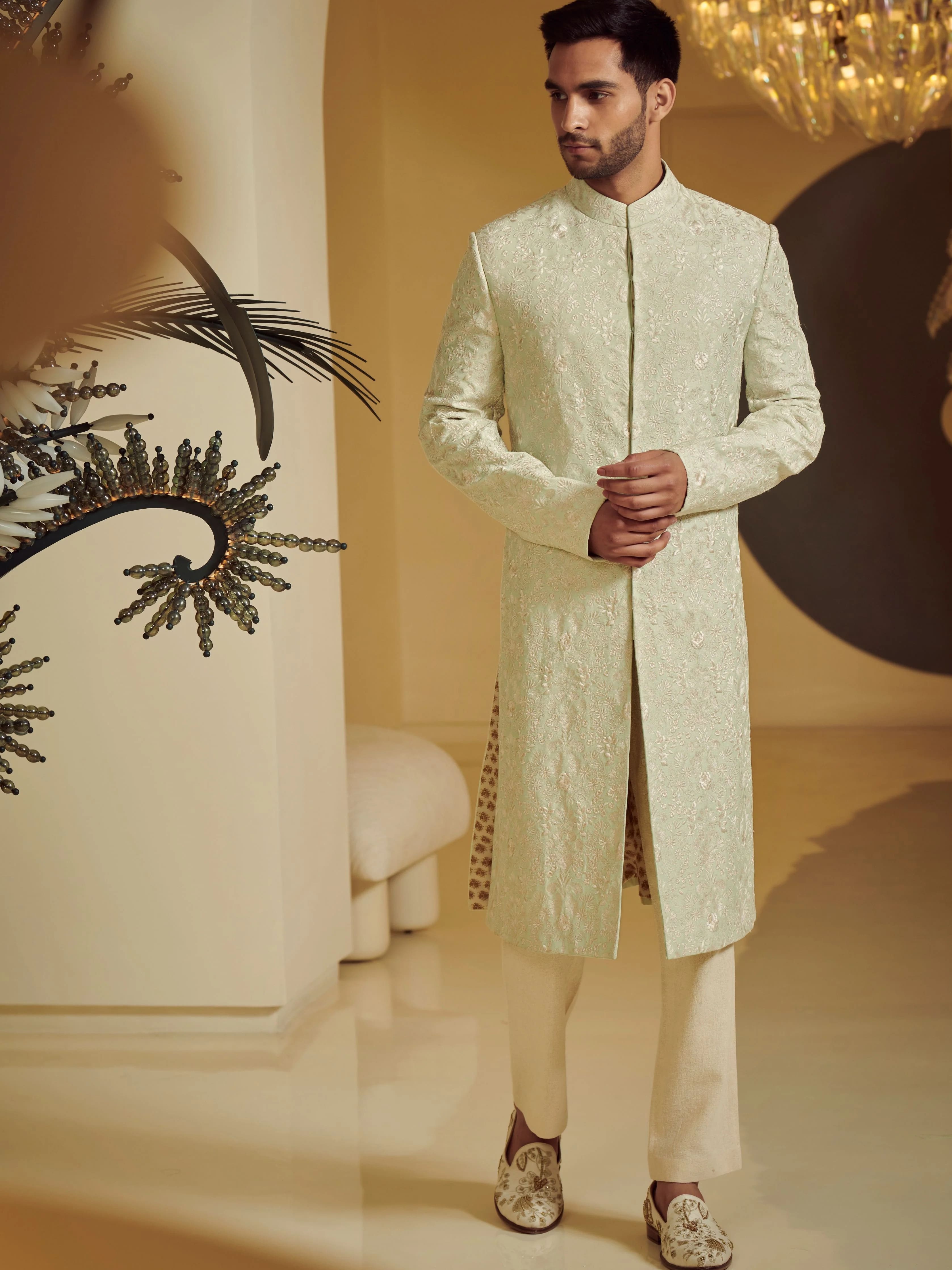 Photo of Black sherwani with gold embroidery on sleeves